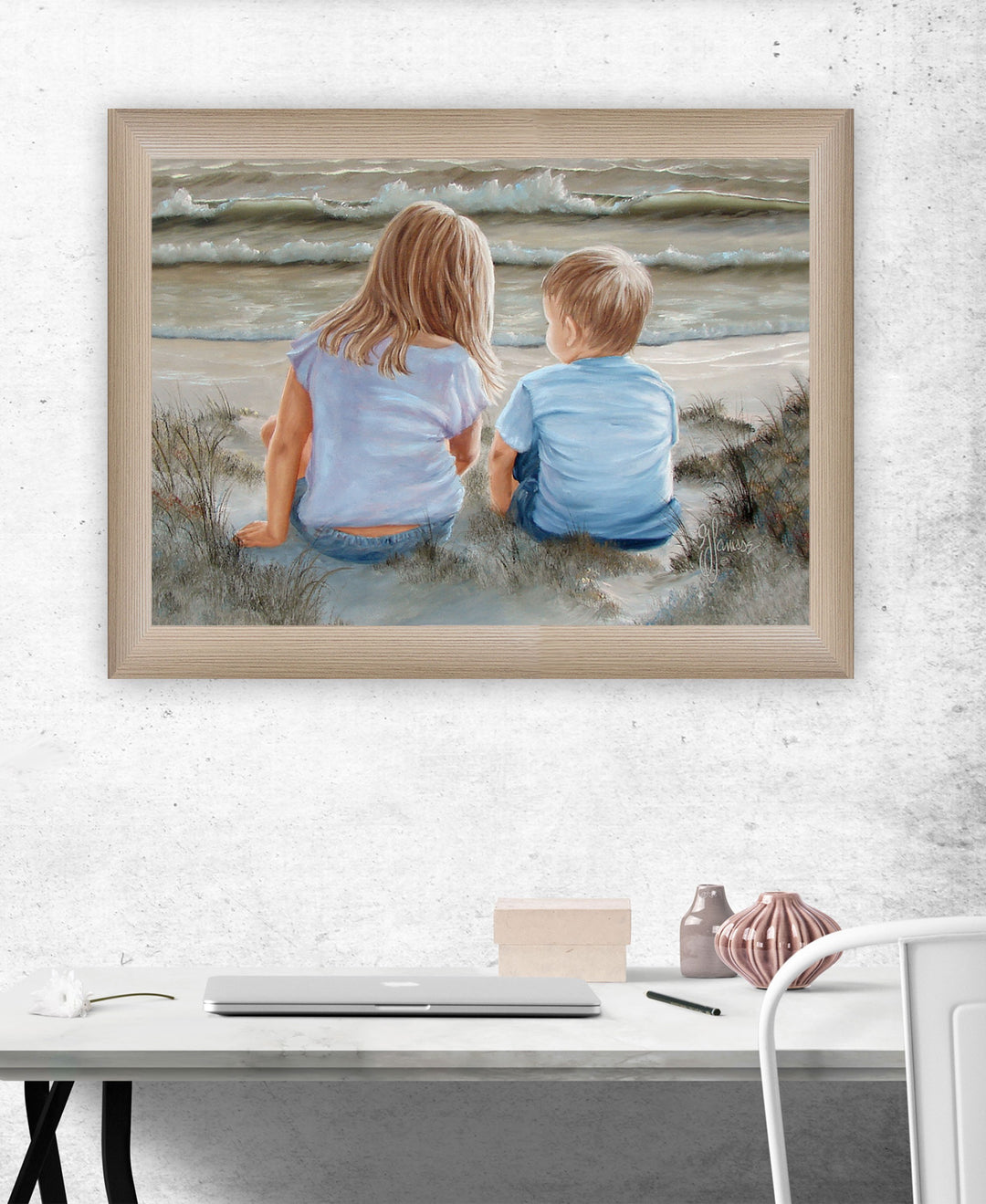 Boy and Girl Sitting in Dunes Brown Framed Print Wall Art