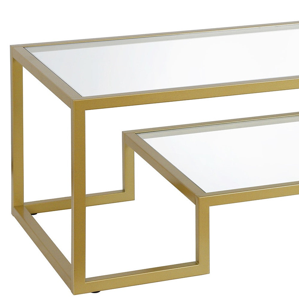 54" Clear And Gold Glass And Steel Coffee Table With Shelf